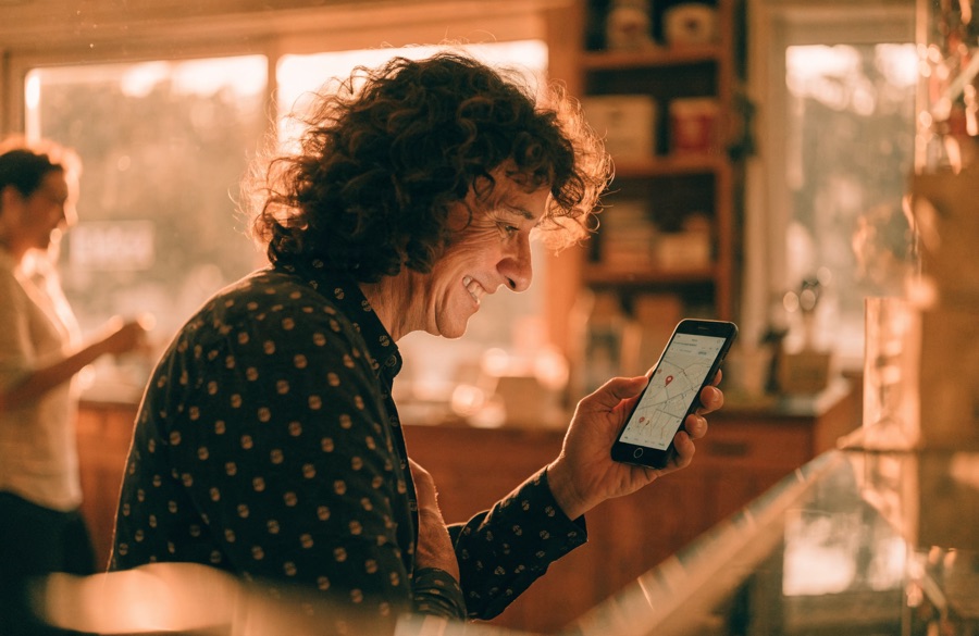 Local business owner checking their phone